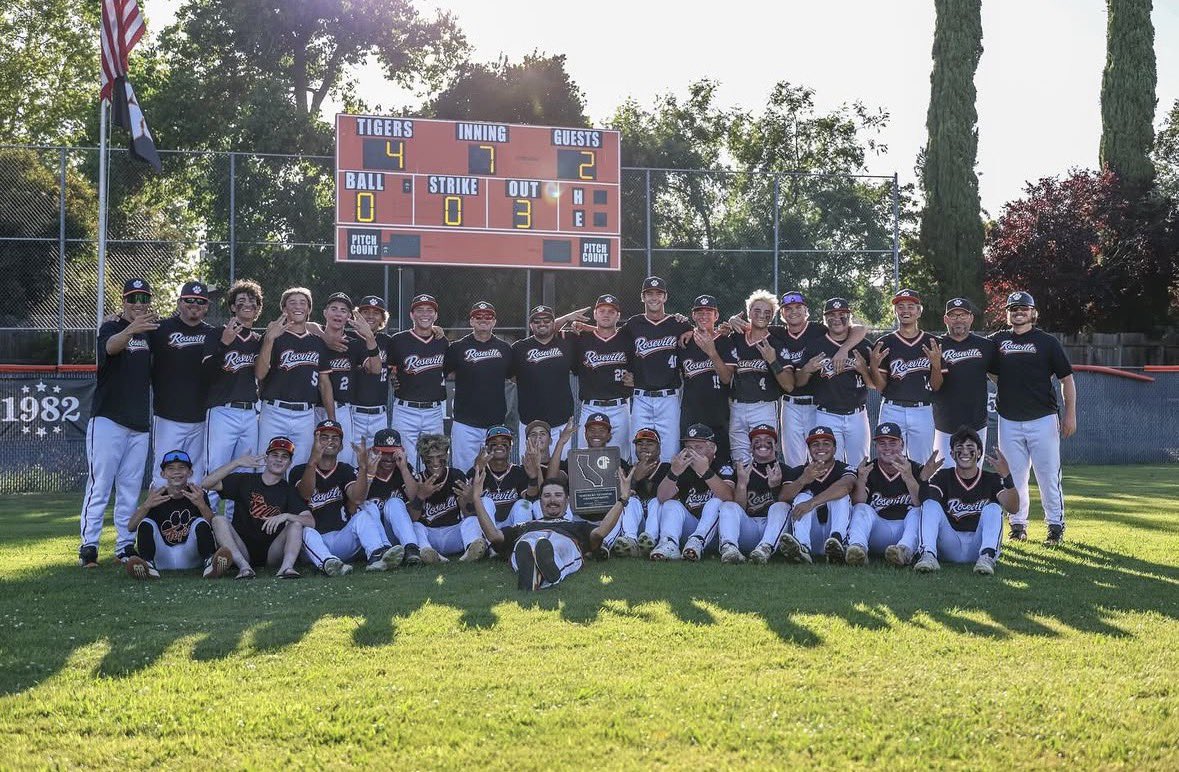 Roseville Tigers players and coaches celebrating their 2026 NorCal championship with the trophy